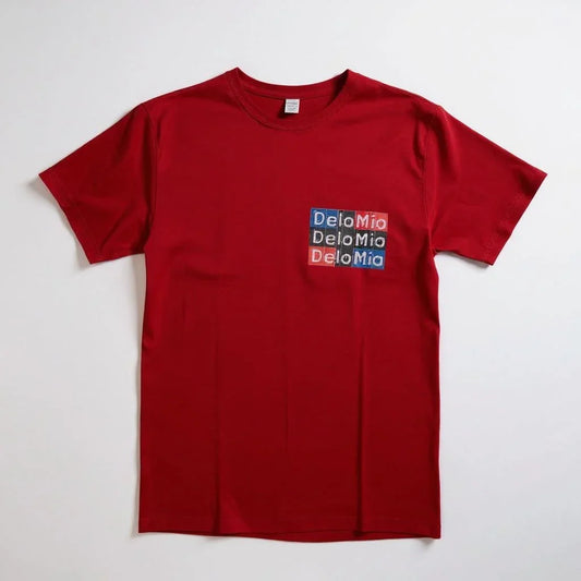 De Lo Mio on the Heart Unisex T-Shirt front view | Minimal text t-shirt over heart | Cultural pride unisex graphic tee | Soft cotton everyday t-shirt | De Lo Mio shirt folded flat lay | Unisex comfort fit t-shirt | Subtle heart placement design tee | Streetwear style De Lo Mio shirt | Trendy cultural statement t-shirt | Breathable cotton unisex top | Gift idea for friends and family | De Lo Mio print close-up on t-shirt