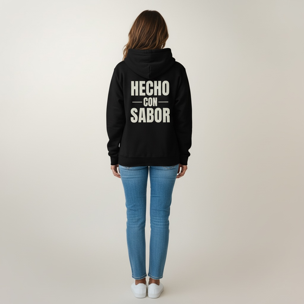 Person wearing a black hoodie with 'HECHO CON SABOR' text on the back, standing against a plain background.